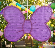 Load image into Gallery viewer, Lavender coquette bow pinata at an outdoor birthday party
