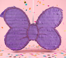 Load image into Gallery viewer, Lavender coquette bow pinata hanging at a party with confetti
